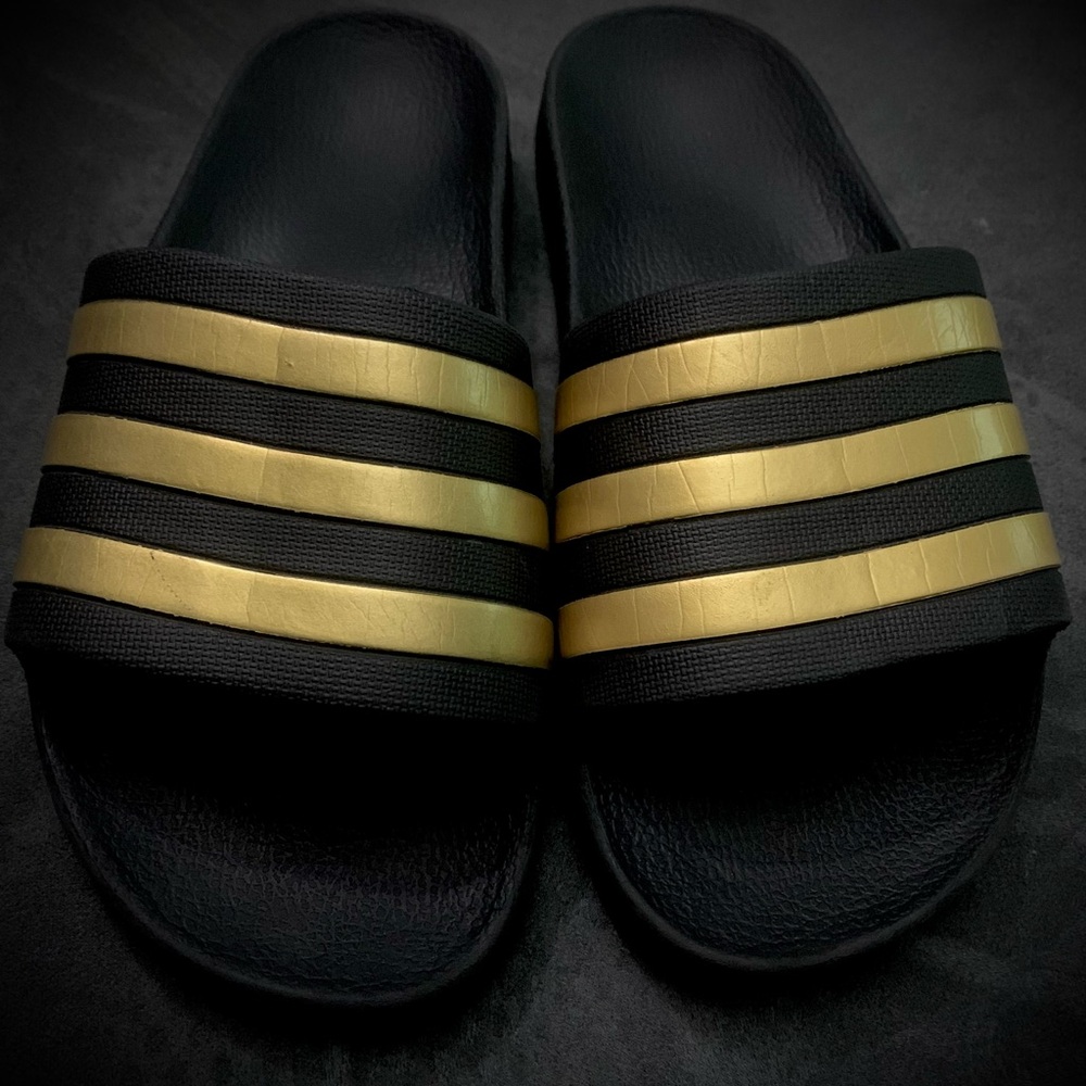 Adidas Black Slides with Gold Stripes